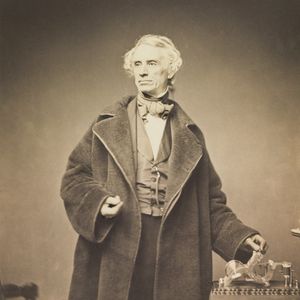 Samuel Morse with his recorder.jpg